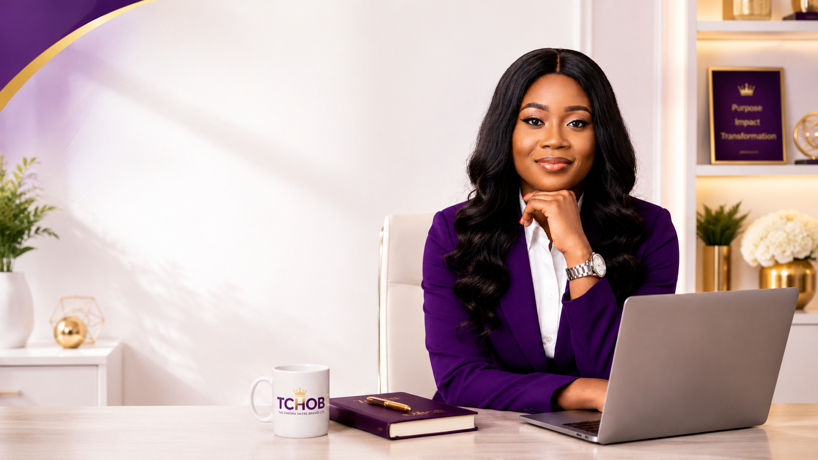 Chioma Okere at her desk wearing a purple suit